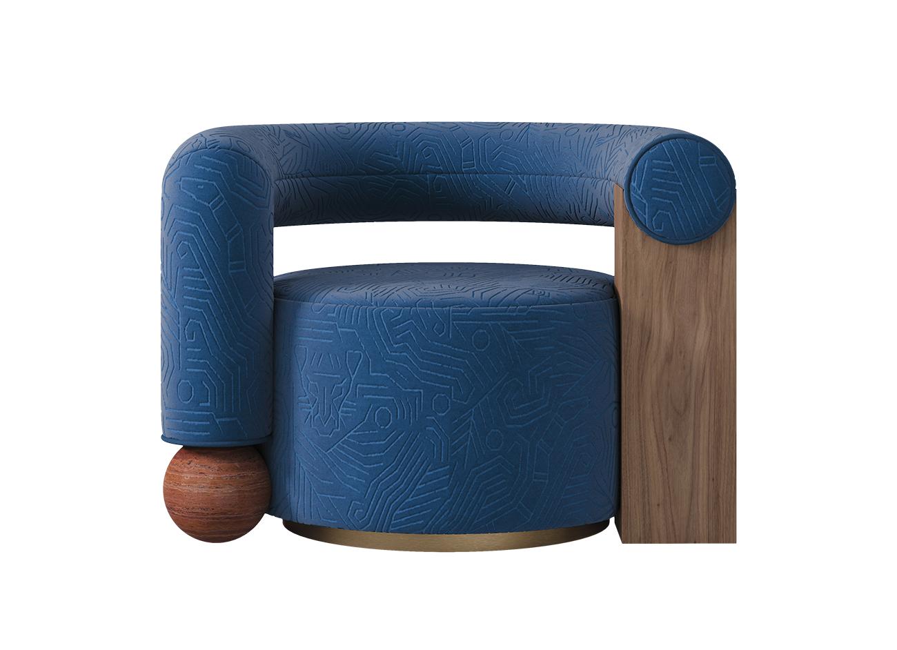 Galatea armchair upholstered in darwinista 007 blue fabric with exotic visions pattern on jacquard velvet, paired with walnut frame and travertine rosso phere base