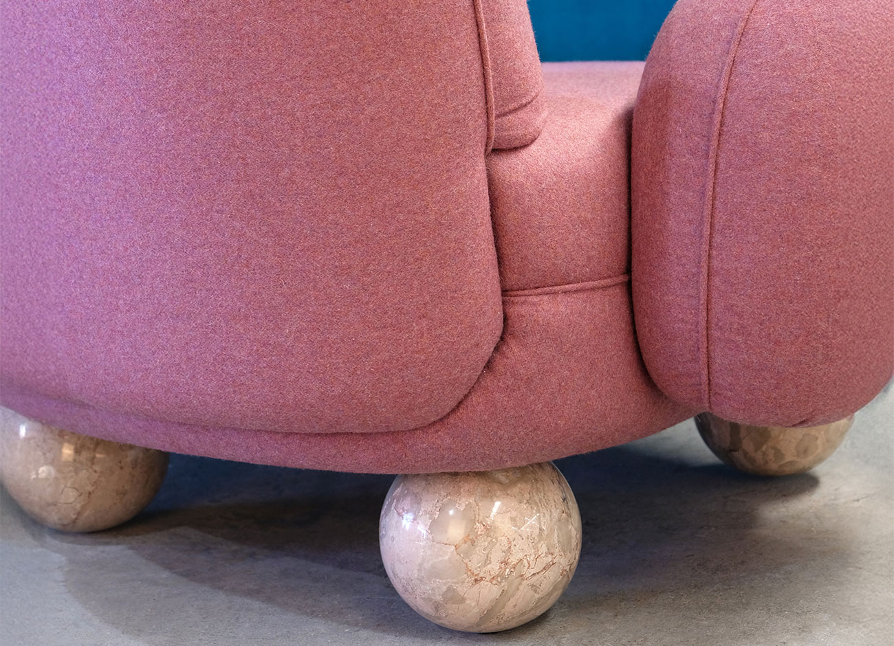Gala Armchair Close-up view of the Gala armchair in pink jacquard Woolly JA1025-064 by JAB, revealing the rich woven texture of the fabric and the elegance of the Breccia Sfere stone legs.