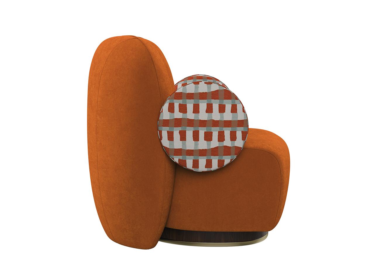 La Voix Armchair La Voix Armchair side view, upholstered in Velours Sienna velvet and Somma jacquard by Nobilis, featuring orange and turquoise tones.