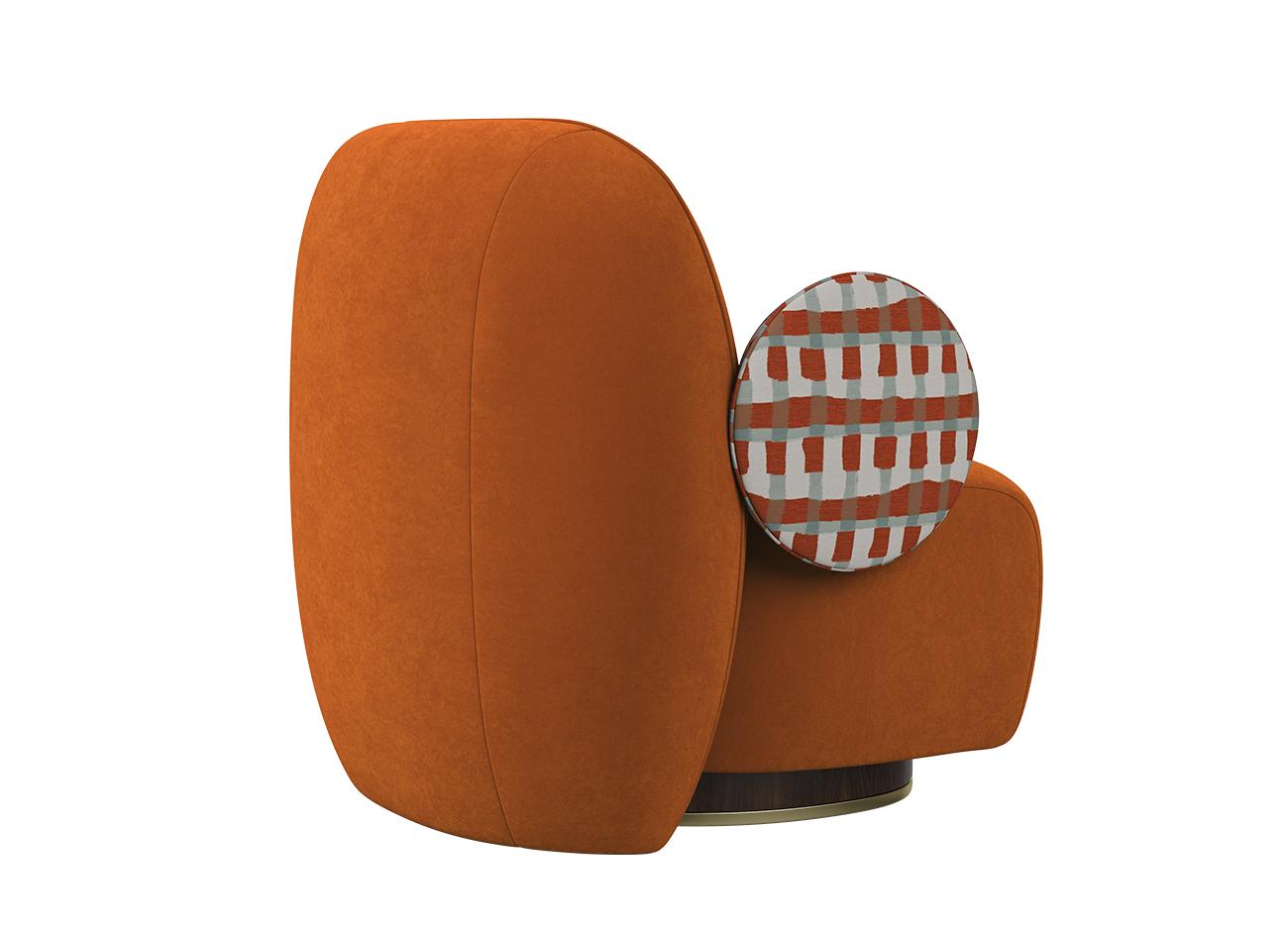 La Voix Armchair La Voix Armchair 45º back view, upholstered in Velours Sienna velvet and Somma jacquard by Nobilis, featuring orange and turquoise tones.