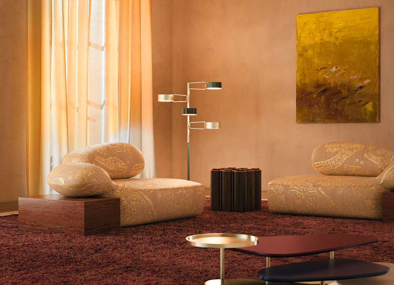 Viv Id chaise longue in a warm-toned living room interior, featuring Tiger Silk 002 fabric by Dedar with yellow highlights and a Travertino Rosso structure. The space also includes the La Toile center table, Kensington Tic-Tac-Toe table, and Brompton Floor Lamp.