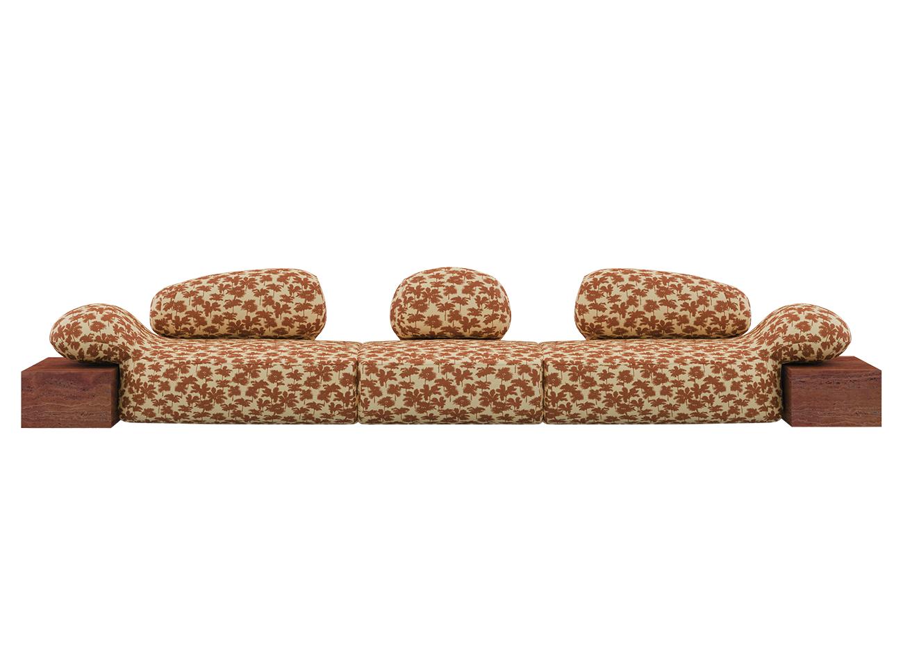 Viv Id II Sofa Front view of the Viv Id II sofa, featuring Be Bop A Lula 007 fabric by Dedar and a Travertino Rosso structure, set against a white background.