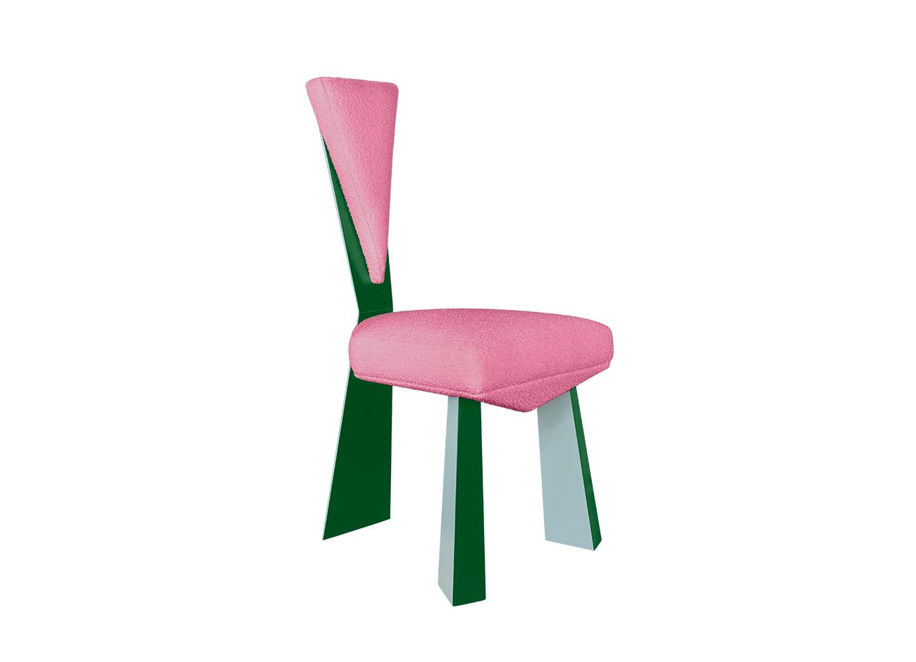 Kju bist dining chair by malabar photographed at a 45-degree front angle against a white background, emphasizing its cubist-inspired angular geometry, planar silhouette, blue and green lacquered legs, and a pink bouclé fabric upholstery.