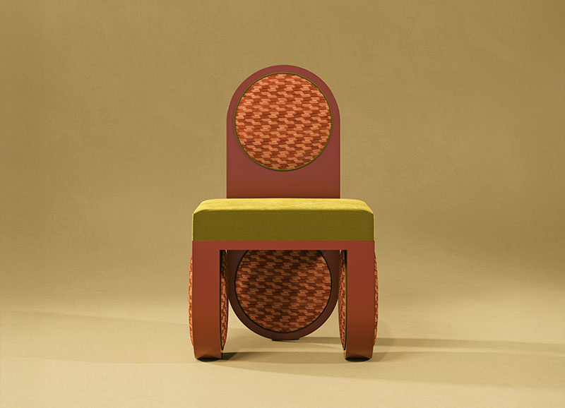Fyoo Cher dining chair with a coral red lacquer finish, upholstered in Strings Clove (K5368/03) and Ice II Fern (K5159/61) fabrics by Kirby, set against a yellow background.