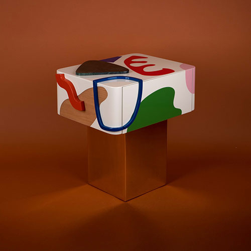 Fauves Bedside Table featuring a wooden structure hand-painted with simple abstract forms but bold colors, adorned with Green Guatemala marble, supported by a polished brass base. This fauvism-inspired Bedside table was designed to boost any art-filled bedroom.
