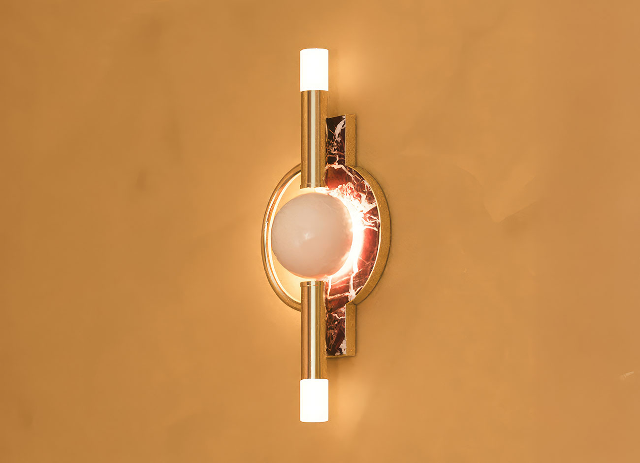 Dallas wall lamp turned on, featuring marble accents, brass details, and a lacquered metal finish.