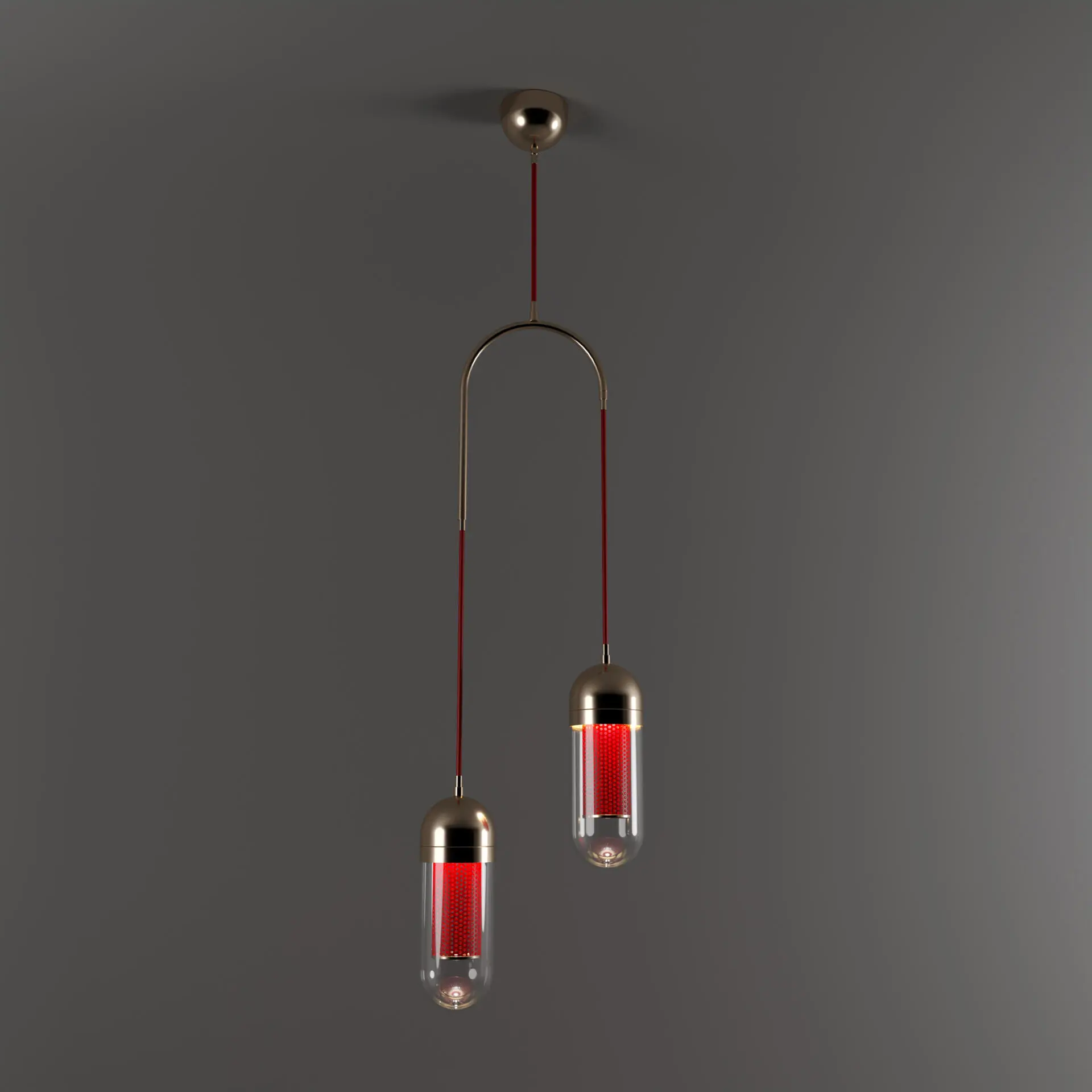 Dender II Pendant Lamp lacquered in red with polished brass details, light turned on and shining through the perforated metal.