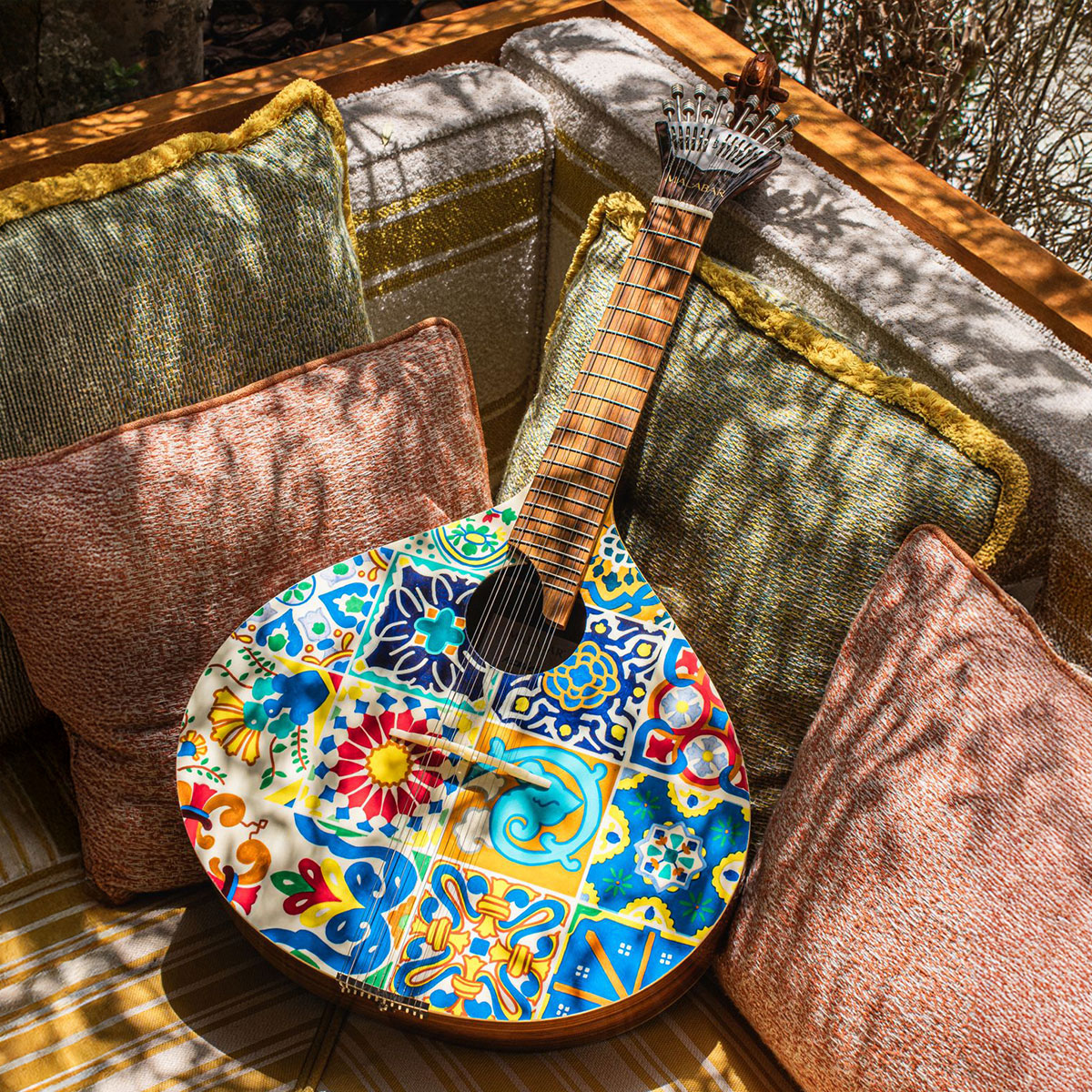 Azulejo I guitar with hand-painted tile pattern, featured at Lana Lusa Restaurant in Dubai, UAE.