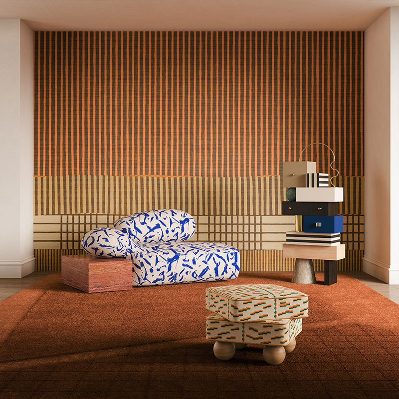 Living room set featuring playful shapes and bold contrasts: the viv id chaise longue upholstered in ichi-go ichi-e 001 fabric by dedar milano, paired with a geometric travertino rosso cube. The madonna stool, with whimsical oak sphere legs and tiger beat 004 upholstery by dedar milano, adds a sculptural touch. Completing the scene, the sketch chest of drawers with ultramarine blue drawers is crowned by a round verde guatemala marble sphere and anchored on a travertine base.