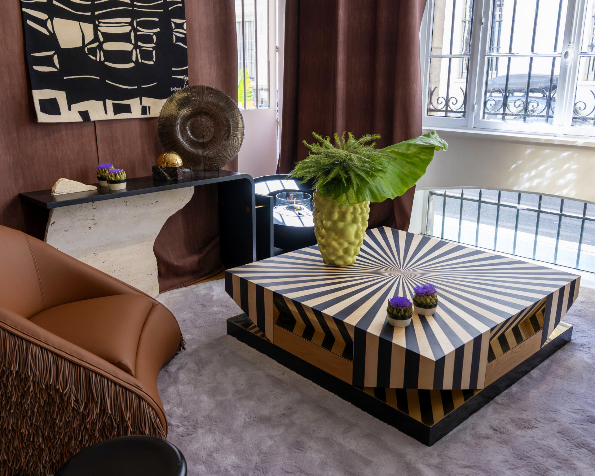 Op art center table at paris design week 2025 with a striped marquetry black and white top.