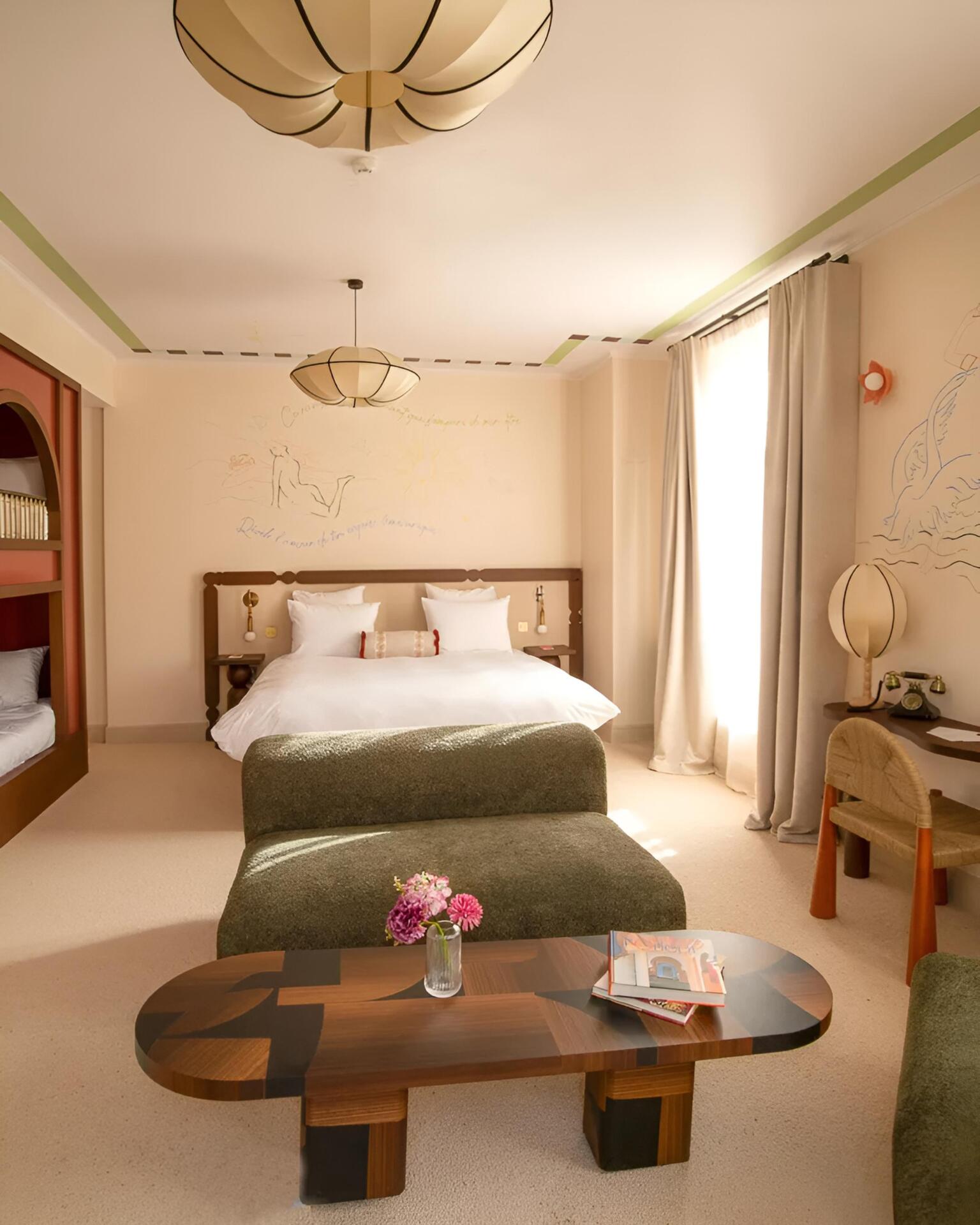 Artful hotel: suite in the hotel with lyrical frescoes covering the walls.