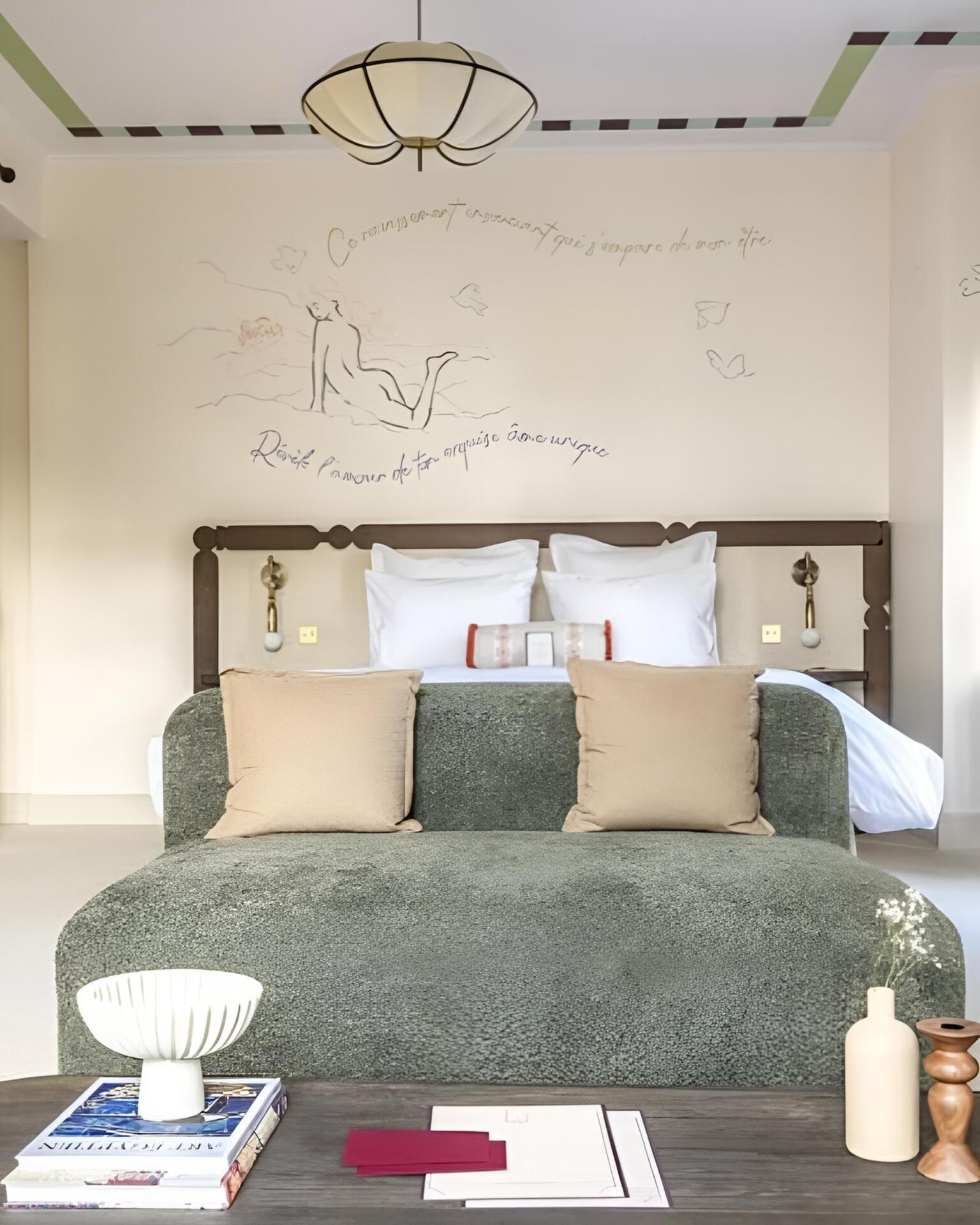 Artful hotel: suite in the hotel with lyrical frescoes covering the walls.