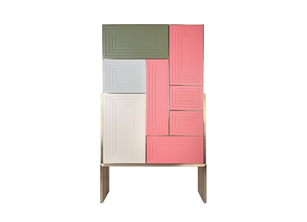 Venezia cabinet Venezia cabinet set against a white background, featuring a brass structure and pink, beige, soft blue, and green rectangular panels.