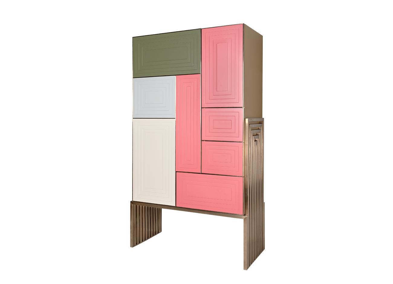 Venezia cabinet 45-degree view of the venezia cabinet set against a white background, featuring a brass structure and pink, beige, soft blue, and green rectangular panels.