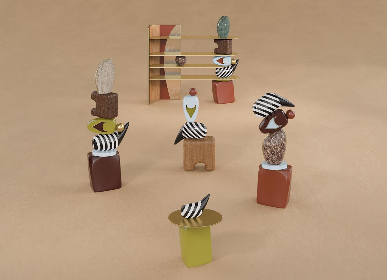 An artistic composition featuring the echoes bookshelf in the background and several smaller totem-like sculptures in the foreground. These smaller pieces use the same design language: striped patterns, marble spheres, wooden blocks, and colorful ceramic shapes, creating a cohesive collection of objects on a sandy-textured floor.