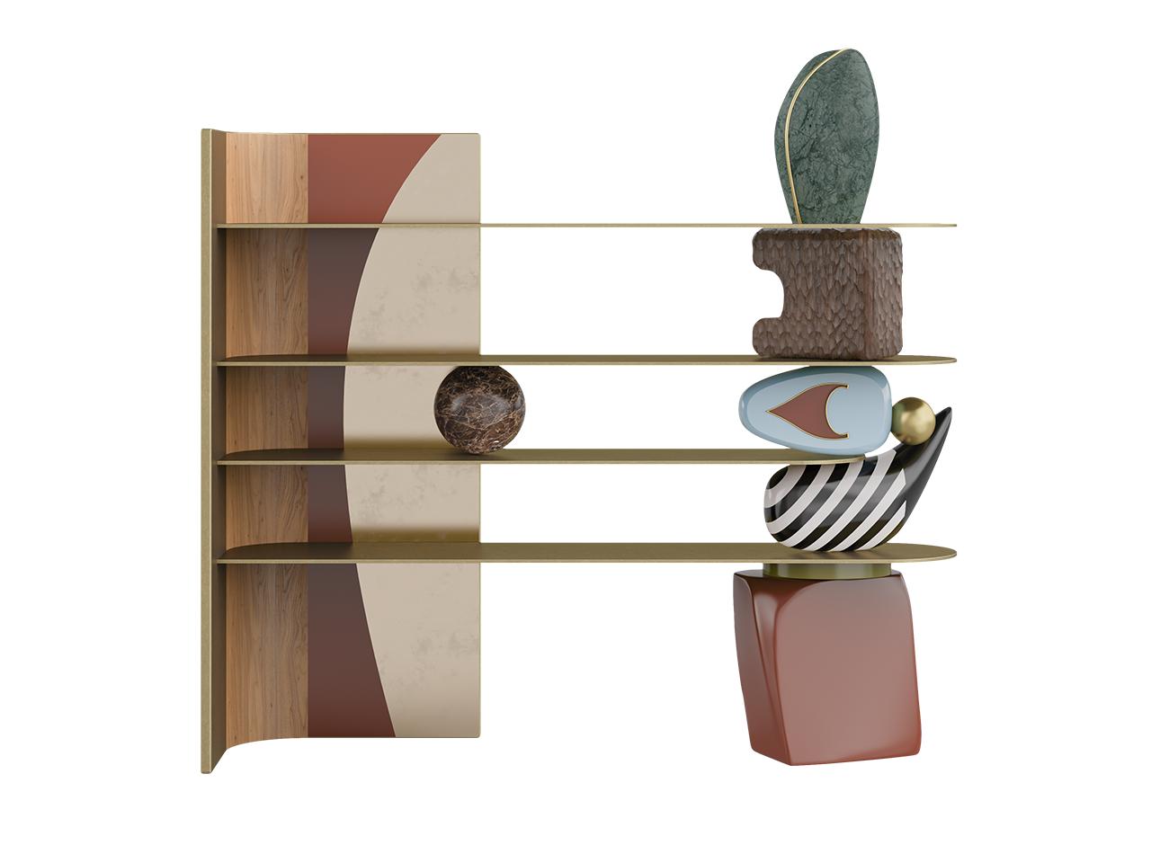 A front view of a sculptural designer bookshelf against a solid black background. The piece features four thin, gold-toned metal shelves supported on the left by a curved vertical panel with wood grain, terracotta, and cream accents. On the right, the shelves are balanced by a vertical stack of colorful, organic, and geometric shapes, including a red ceramic base, a black-and-white striped form, and a green stone at the top. A single brown marble sphere rests on the second shelf.