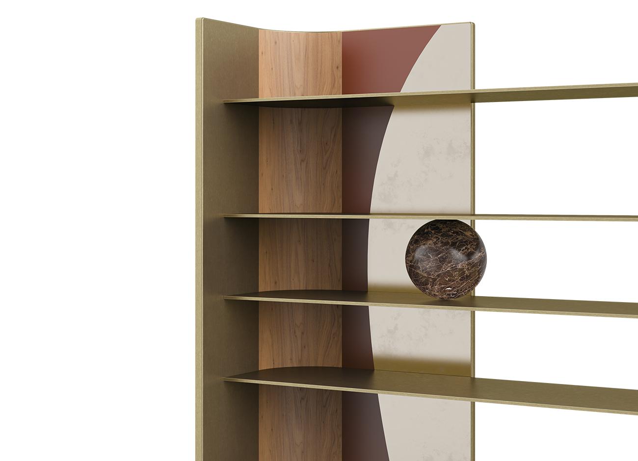 A close-up detail of the left side of the echoes bookshelf. The image highlights the golden metallic side panel and the decorative backplate combining natural wood textures with burgundy geometric shapes and a mottled cream semicircle. A dark brown marble sphere is positioned in the center of one of the thin gold shelves. Black background.