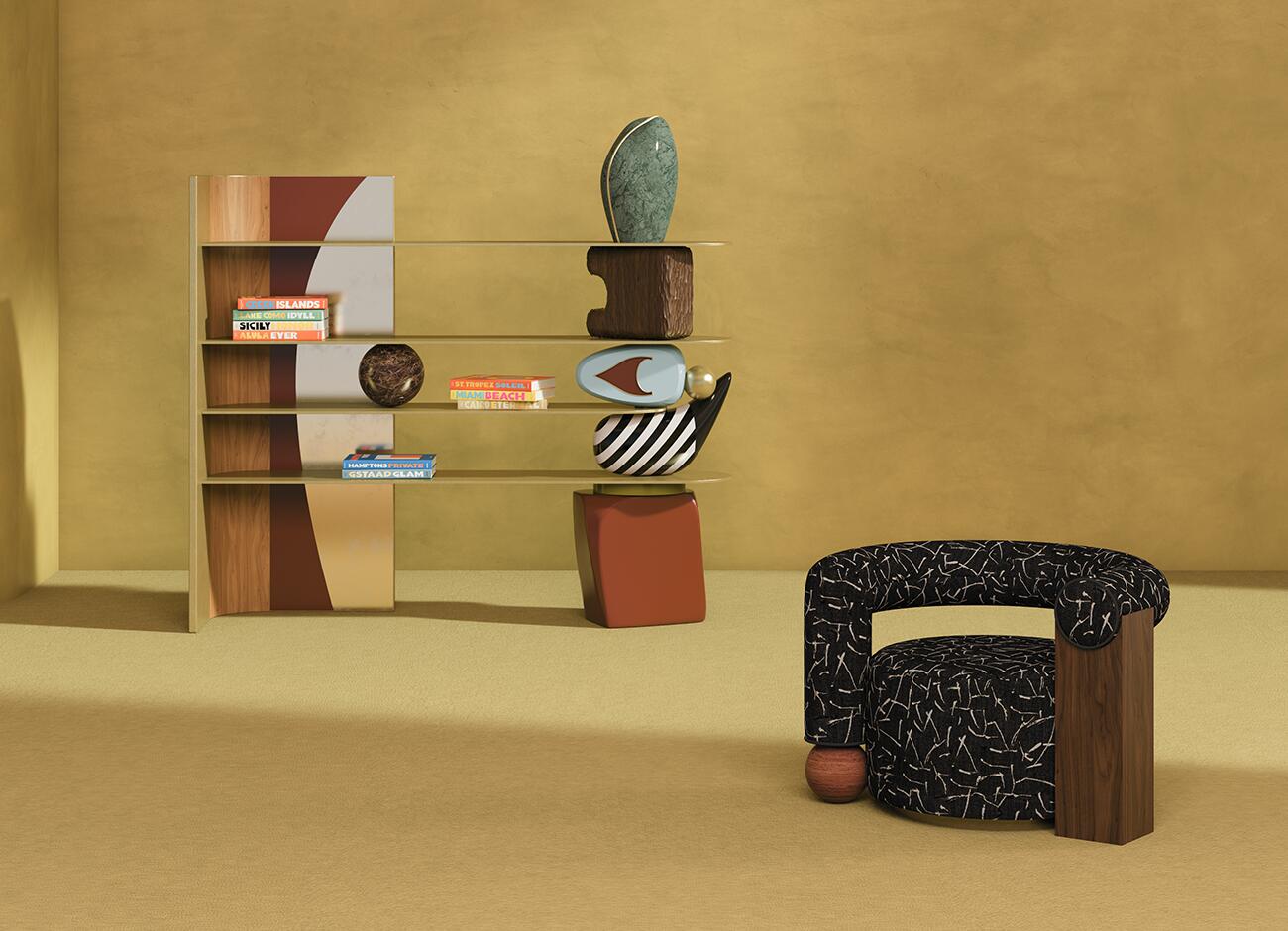 The echoes bookshelf styled in a minimalist room with warm ochre tones, paired with the galatea armchair, which features black patterned upholstery and a solid wood armrest. The bookshelf is supported by its signature stack of abstract sculptural elements in marble and wood, creating a sophisticated and artistic interior setting.