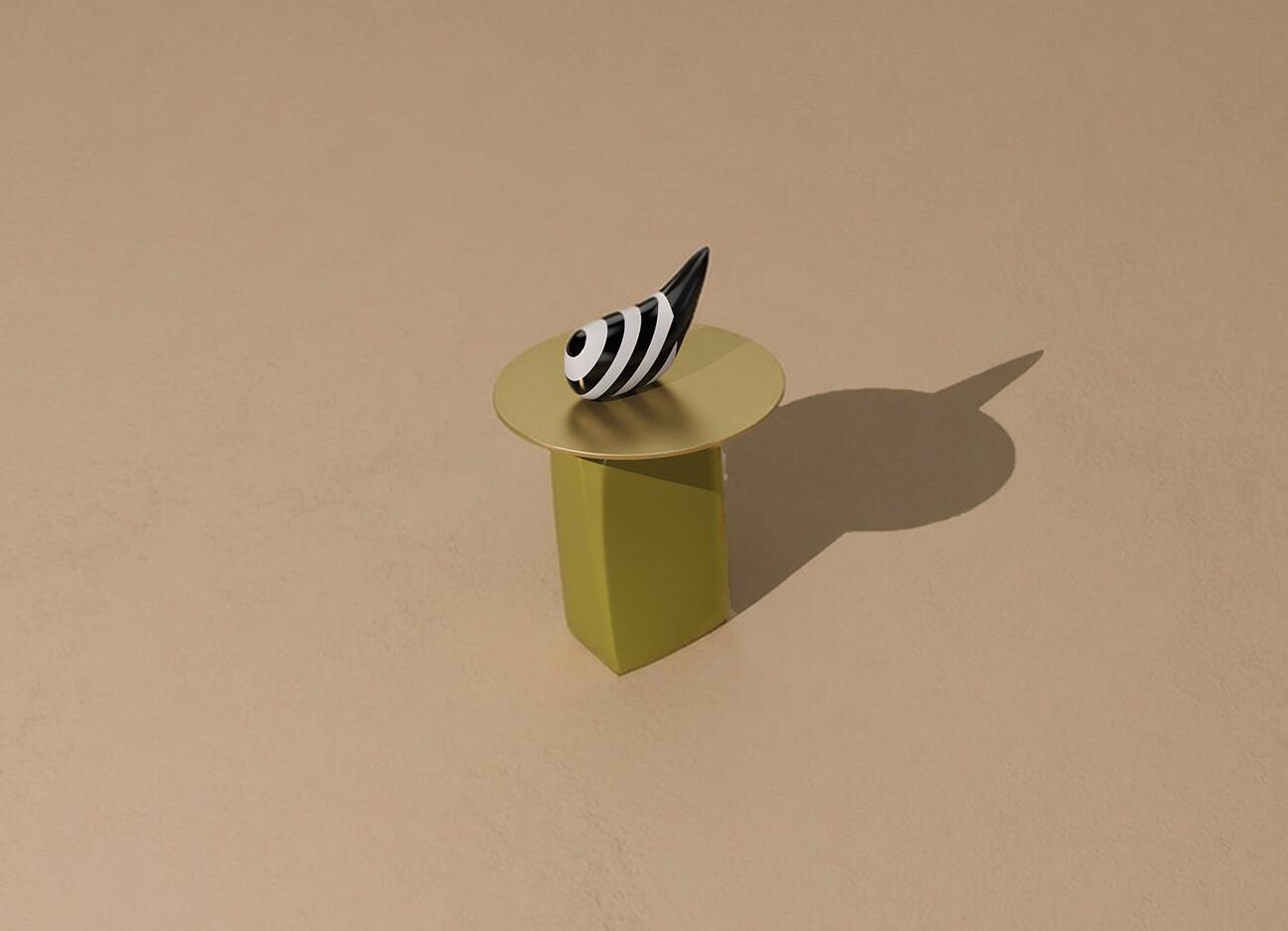 High-angle diagonal view of the echoes side table against a textured beige background. The table has an olive-green lacquered wood base and a brushed brass top. The black and white striped decorative piece casts a sharp shadow to the right.