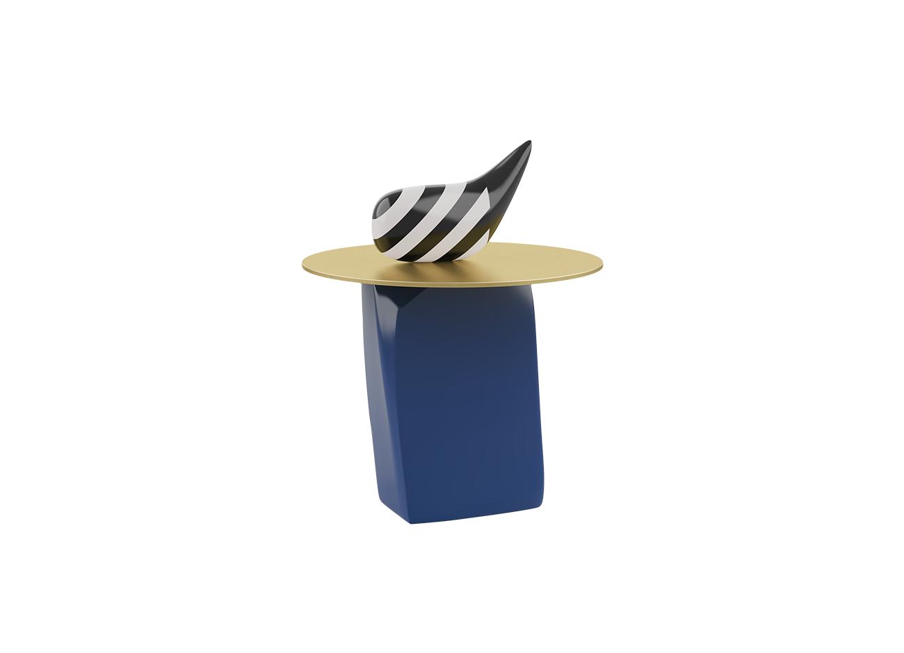 The echoes side table isolated on a white background. This version highlights a deep navy blue lacquered wood base contrasting with the circular brushed brass top. The curved black and white striped decorative object sits on the surface.
