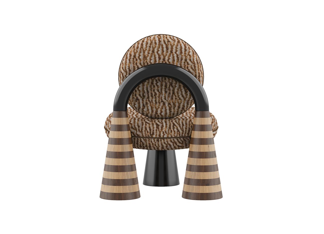 A direct rear view of the totara armchair by malabar. The symmetrical composition emphasizes the monumental, statuesque nature of the piece. It features brown and ochre patterned misia fabric, a central high-gloss black lacquer arch, and two flanking conical legs with handcrafted oak and walnut marquetry stripes. A third black conical leg is partially visible beneath the seat.