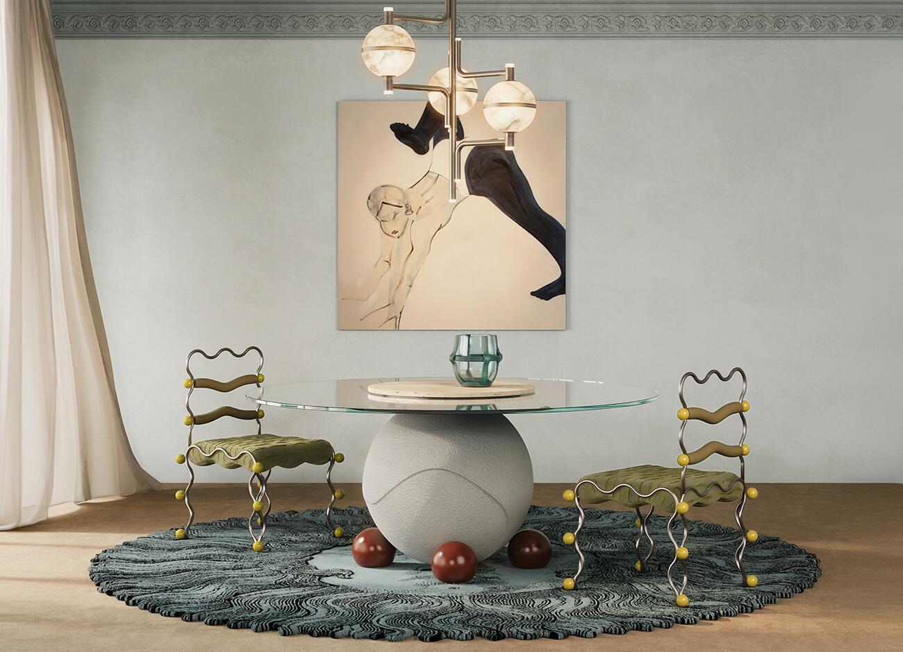Vela dining chair A contemporary dining room featuring a pair of vela dining chairs by malabar with wavy metal frames, olive green seats, and yellow spherical accents, arranged around the circulus dinign table with a glass-top round and a spherical stone base. The room includes a textured blue circular rug, and the modern multi-globe andros suspension lamp, and an abstract figurative painting on a light blue colored wall.