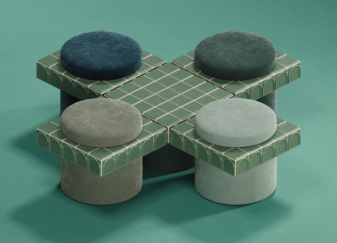 Enigma i stool An oblique top-down perspective view of a modular configuration of round stools and one side table. A central square platform of light green ceramic tiles (barro. - iced) is surrounded by four stools, each with a cylindrical base and a square tile collar featuring an arched relief pattern. The soft jade fabric seats (kirkby design - rest fr - soft jade - k5266/09) are upholstered in four distinct velvet shades: navy blue, deep forest green, taupe grey, and a lighter sage green. The entire assembly sits on a smooth teal-green surface, against which it casts shadows.